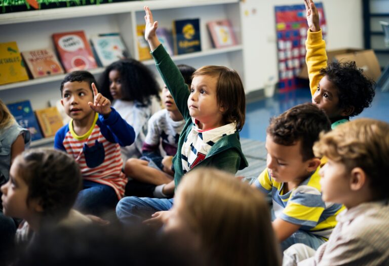 Kindergarten students sitting on the floor